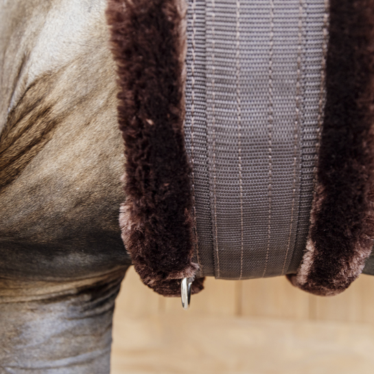 Brown sheepskin riding girth