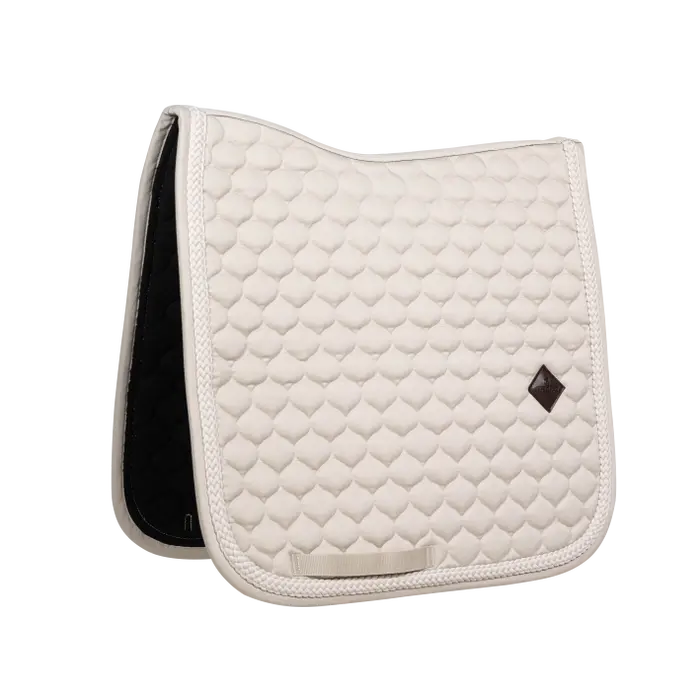 Beige colored dressage saddle pad