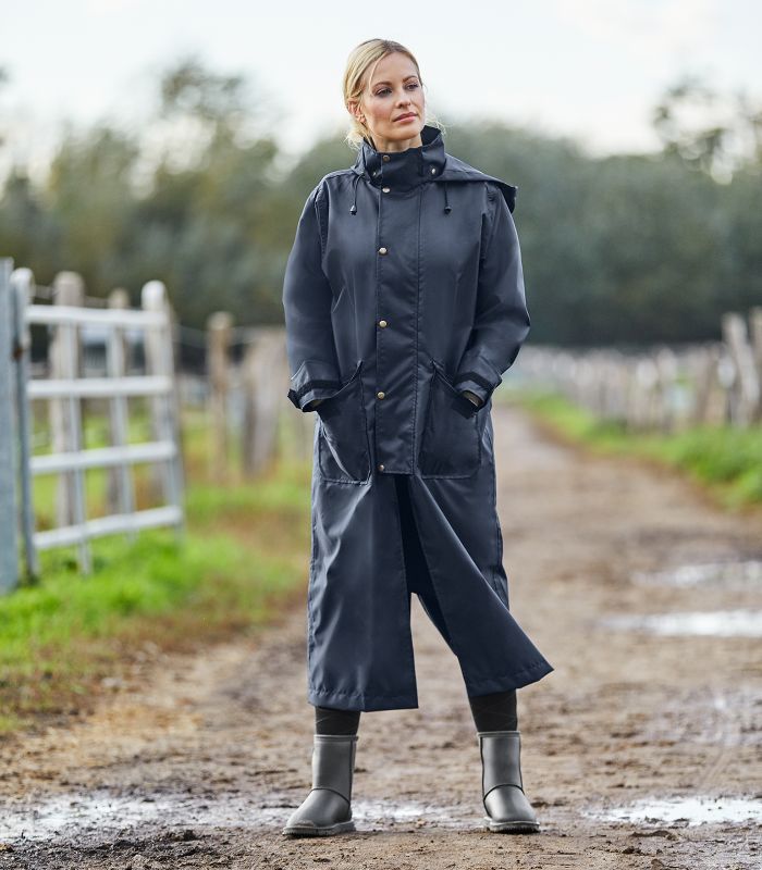 Raincoat with underarm perforations