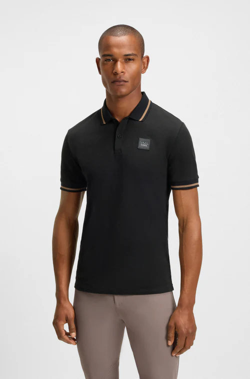 Man wearing a BOSS equestrian Polo shirt in black
