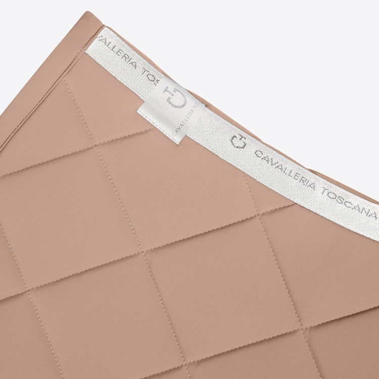 Close-up of a brown fabric with &