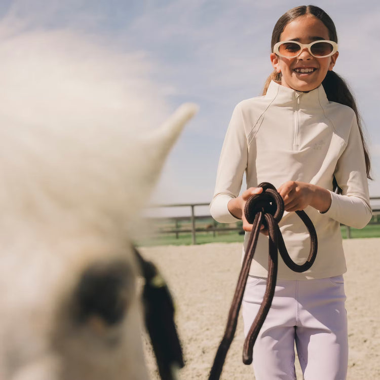 Girls stretch training shirt for riding with unrestricted freedom of movement.