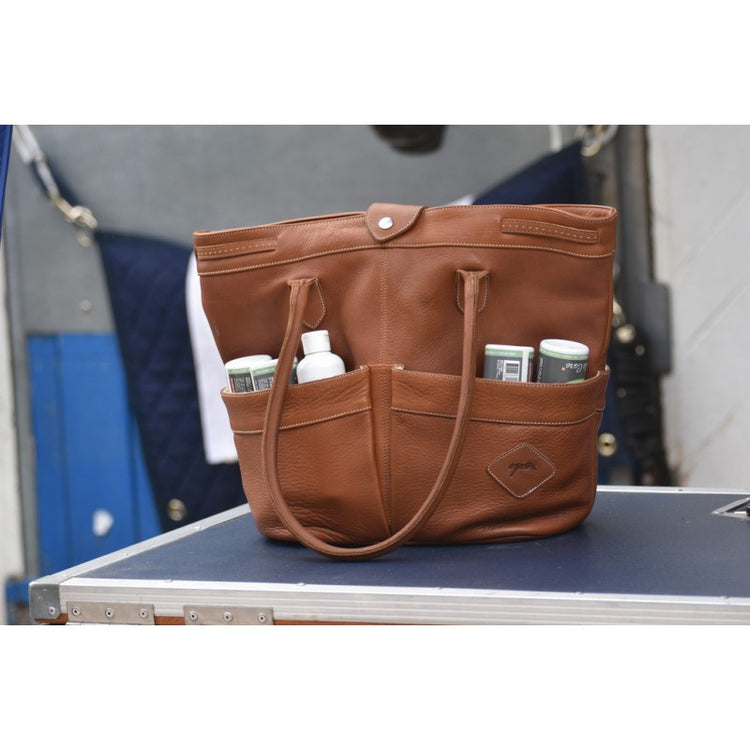 Leather grooming tote for horse supplies that can also be used as a handbag.