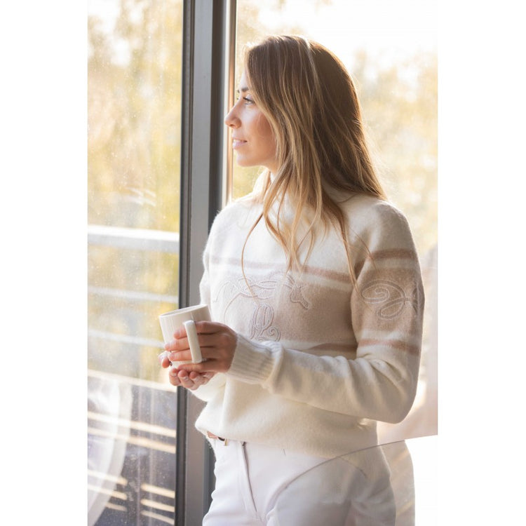 Purchase Penelope equestrian winter clothing online - woman wearing a white Penelope Collection winter sweater