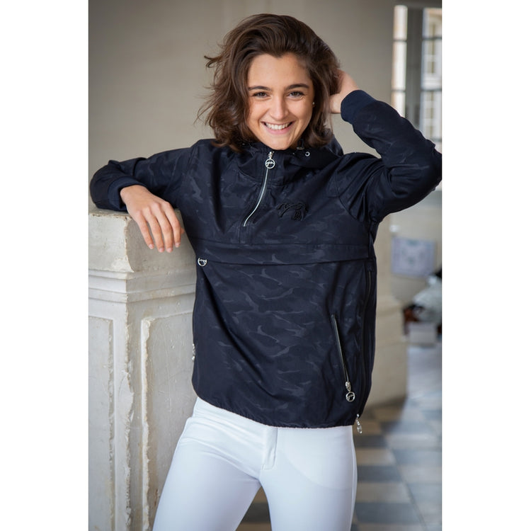 Rain jacket for horse riders with practical equestrian features.
