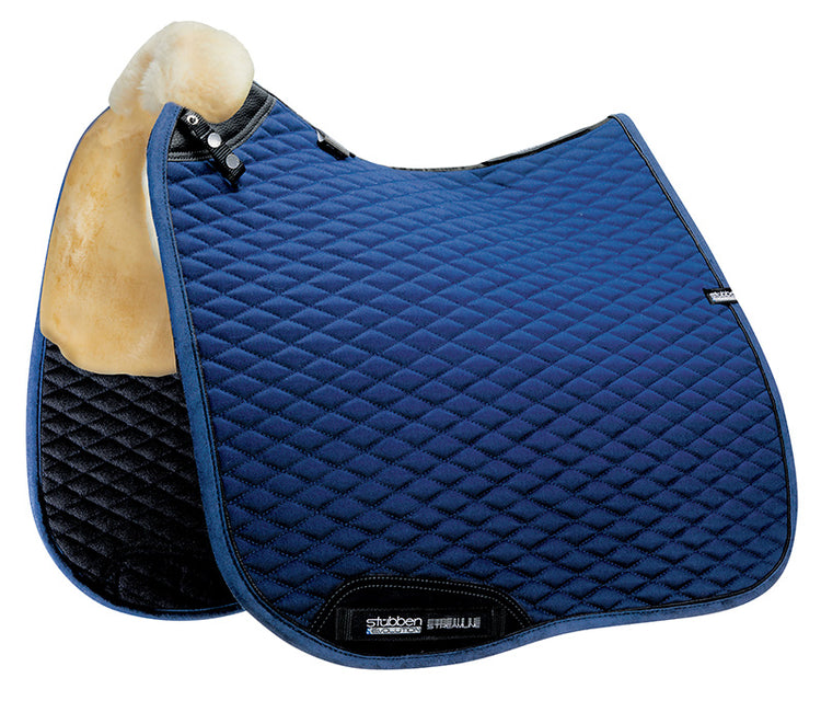 Horse wearing the Stübben Streamline Lambswool Dressage Pad beneath a dressage saddle.