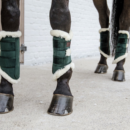 Green coloured brushing boots