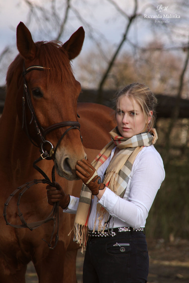 Brown leather riding gloves