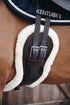 Anatomic shaped dressage girth with sheepskin