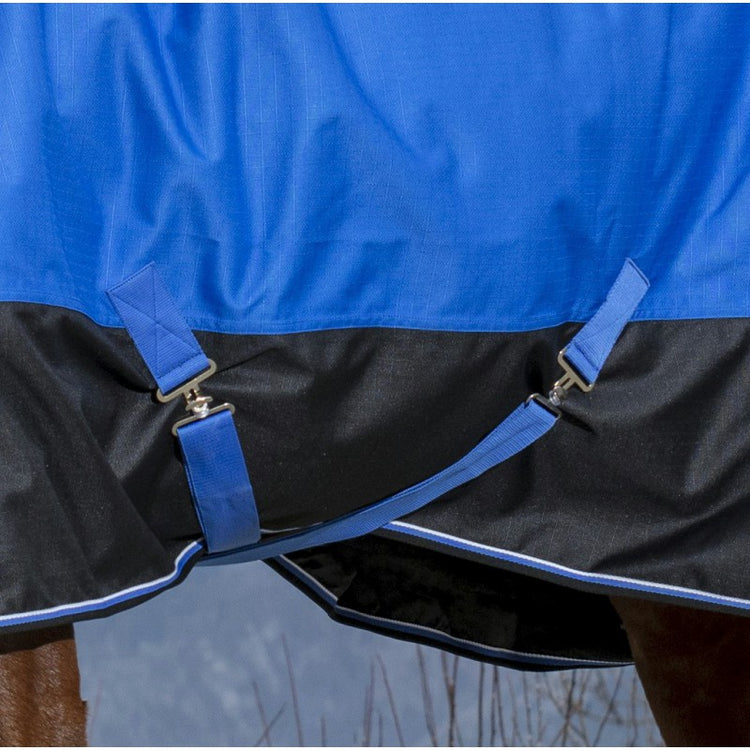 turnout rug with a very large waterproof tail flap featuring a reflective strap, comfort gussets, low-cross surcingles and thigh straps