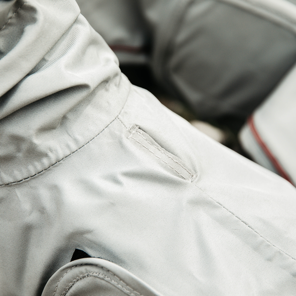 Waterproof coat for dogs with a lead pass