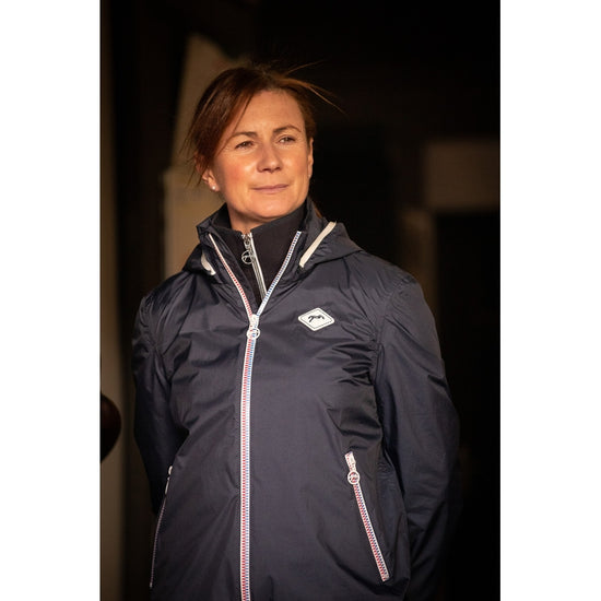 Penelope women’s equestrian rain jacket for wet days at the stable.