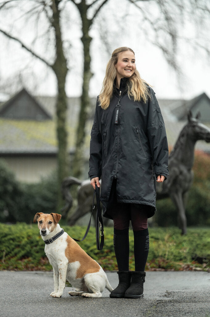 Waterproof equestrian jacket with riding slits