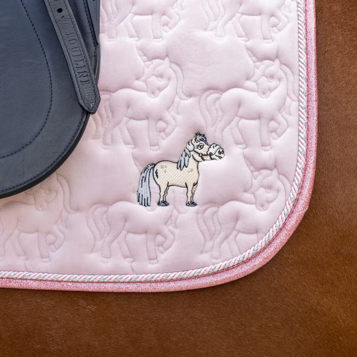 Horse saddle pad with unicorn quilting design