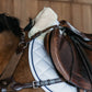 White jumping saddle blanket with sheepskin underside