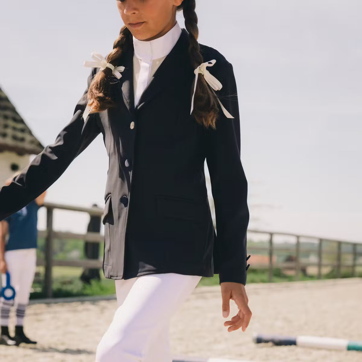Young rider wearing Kentucky Paris Girl show jacket