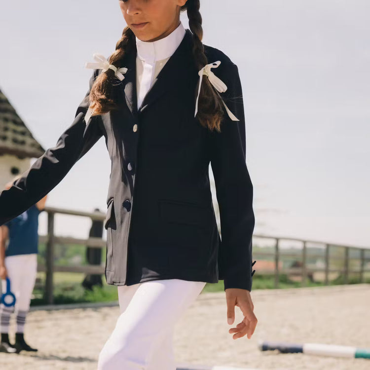 Young rider wearing Kentucky Paris Girl show jacket
