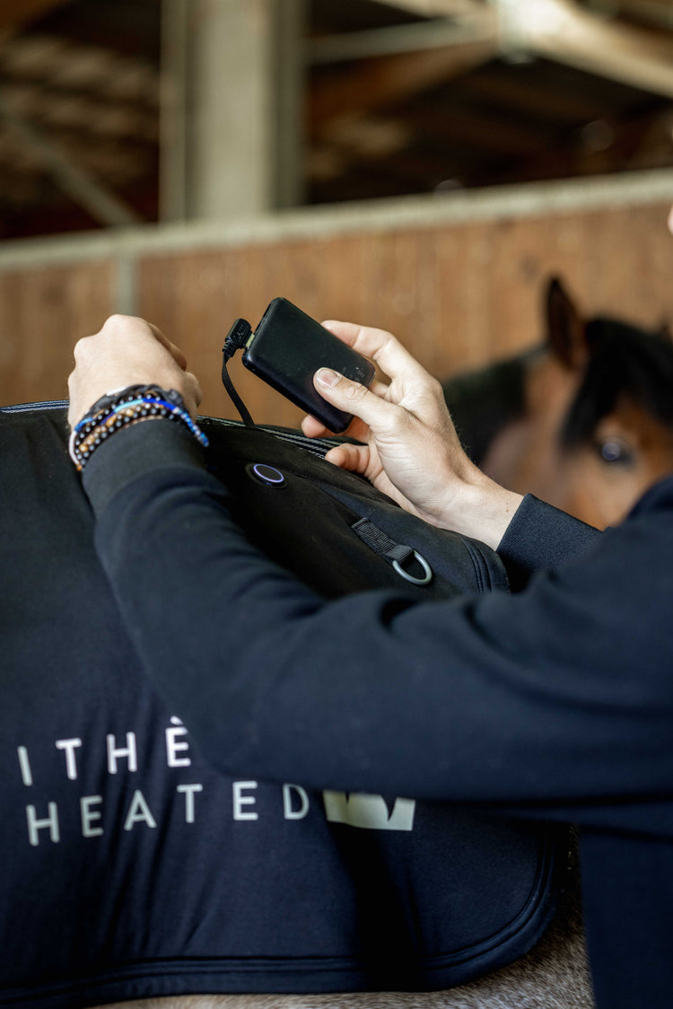 Close-up of Equithème Heated Back Warmer battery pocket