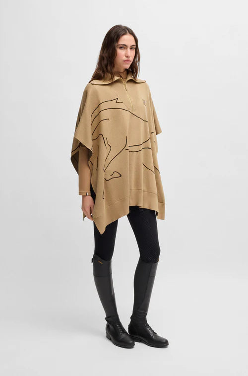 Woman wearing the Boss Equestrian Alisha Cape in Camel color