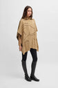 Woman wearing the Boss Equestrian Alisha Cape in Camel color