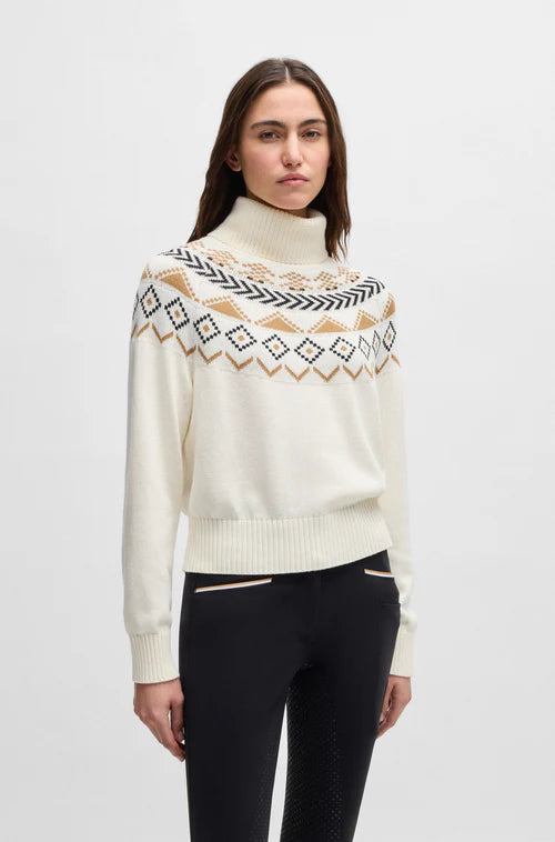 Woman wearing a Hugo Boss cream colored roll neck sweater