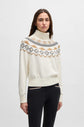 Woman wearing a Hugo Boss cream colored roll neck sweater
