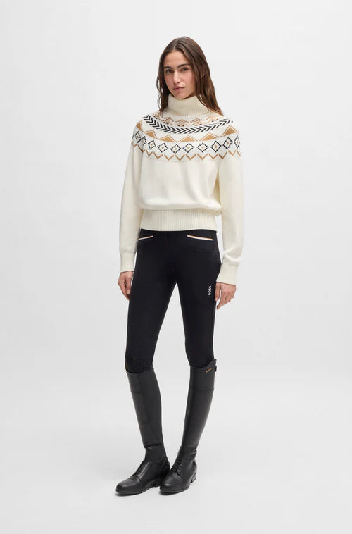 Cream colored winter turtleneck sweater with winter pattern