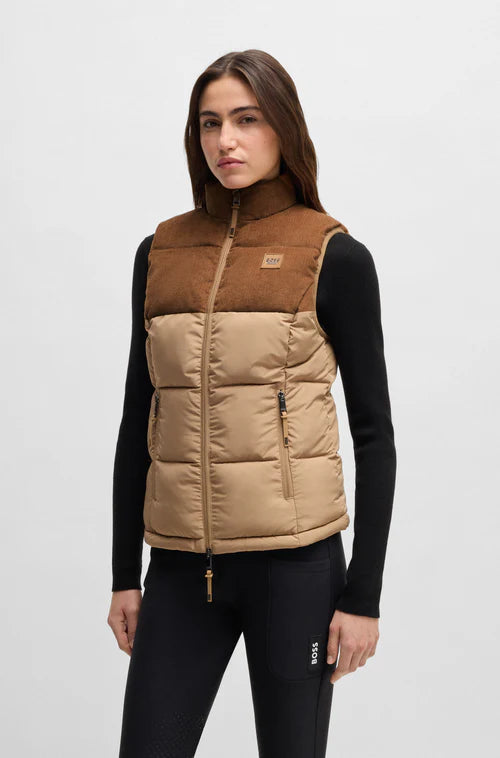 Woman wearing a two-tone brown and beige puffer vest