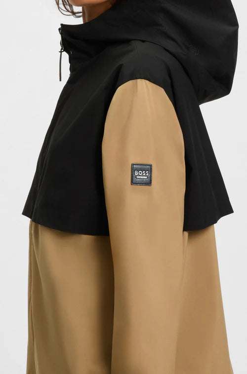 Rain jacket for wearing over airbag vest