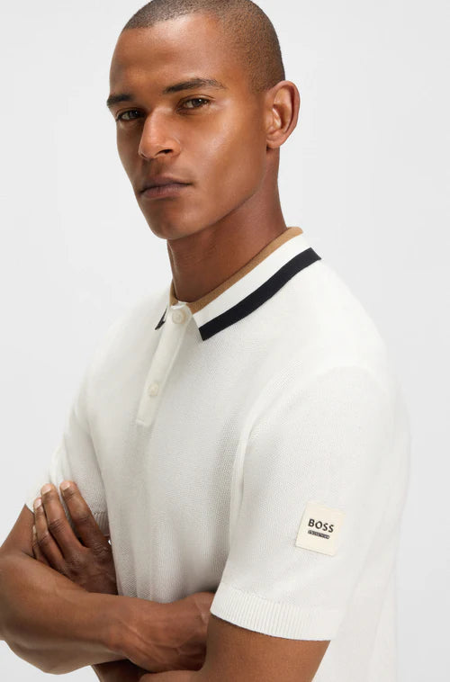 man wearing Boss polo shirt in cream