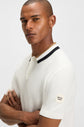 man wearing Boss polo shirt in cream