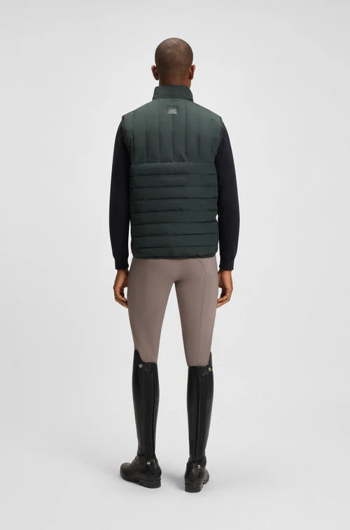 Man wearing the Boss Equestrian Ruben Puffer vest in Pine green