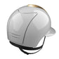 White horse riding helmet with gold details