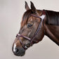 Throatlatch connected to the noseband for stability and proper positioning