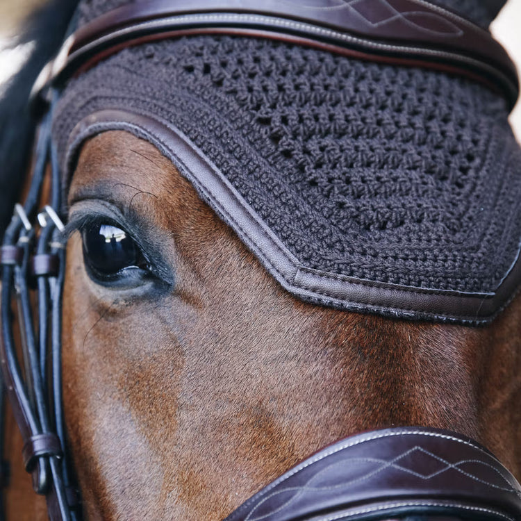 Brown artificial leather edge topping off ear bonnet