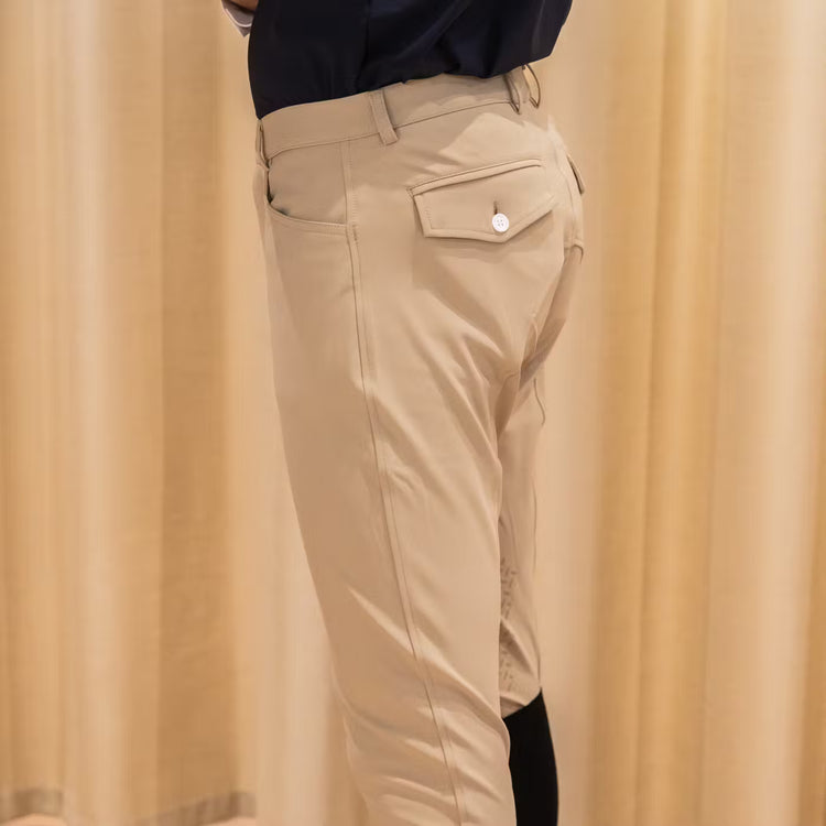 Man wearing beige riding pants with knee grip