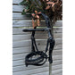 Anatomical bridle for ponies with a pressure-distributing headpiece.