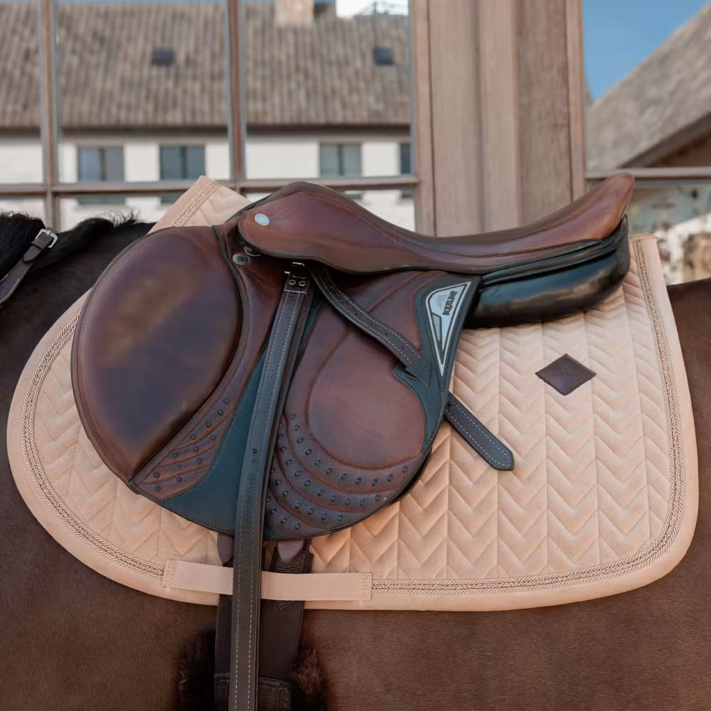 Luxury horse saddle pad with velvet fabric and elegant mini pearl detailing.