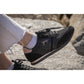 Black glitter sneakers with rose gold details and shiny black shoelaces.