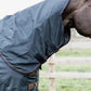 Horse fly and rain protection rug with neck coverage for outdoor turnout.