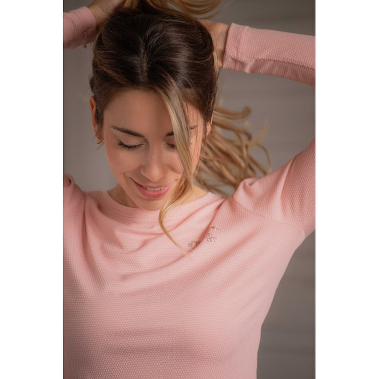 Breathable long sleeve riding top designed for lightweight comfort during equestrian sports.