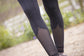 Breathable mesh equestrian leggings with perforated lower leg panels and flexible fabric.