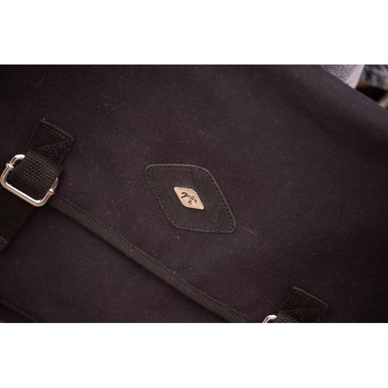 Canvas bag with adjustable strap for comfortable carrying over the shoulder.