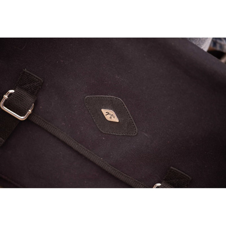 Canvas bag with adjustable strap for comfortable carrying over the shoulder.