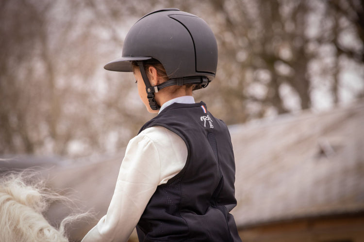 Children’s equestrian airbag vest designed to protect young riders.