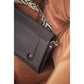 Crossbody equestrian phone pocket with geometric patterned shoulder strap.