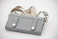 Crossbody phone bag with removable shoulder strap and practical belt attachment loops.