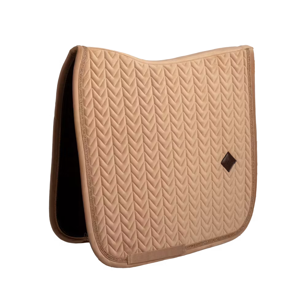 Dressage saddle pad with elegant pearl edging and refined detailing.