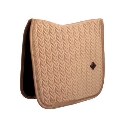 Dressage saddle pad with elegant pearl edging and refined detailing.