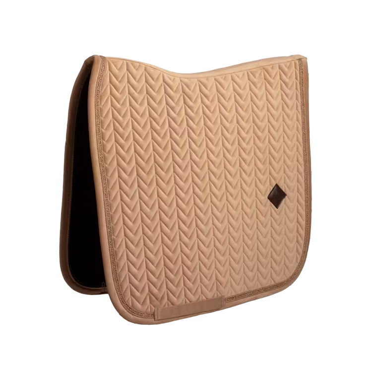 Dressage saddle pad with elegant pearl edging and refined detailing.